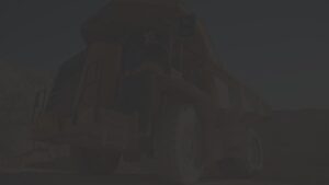 A large yellow mining dump truck, provided by a trusted heavy equipment parts supplier, is parked on a dirt surface. The truck's massive tires stand out amid rocky terrain under a clear sky.